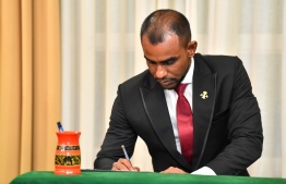 Ibrahim Faisal, the new Minister of Tourism signs on his letter of appointment; Faisal had previously been the special advisor to Dr. Mohamed Muizzu and is the son of Abdul Raheem Abdulla, the leader of People's National Congress (PNC)-- Photo: President's Office