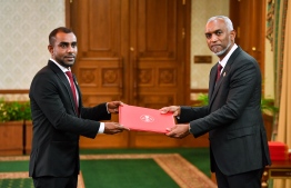 Minister of Tourism Ibrahim Faisal receives his letter of appointment from President Dr. Mohamed Muizzu-- Photo: President's Office
