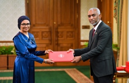 President Dr. Muizzu hands the letter of appointment to the new Minister of Higher Education, Labor and Skills Dr. Mariyam Mariya-- Photo: President's Office
