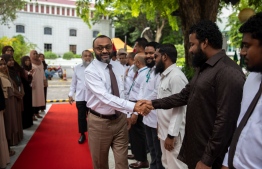 Minister of Islamic Affairs Dr Mohamed Shaheem Ali Saeed greets ministry staff on his first official day.-- Photo: Ministry of Islamic Affairs