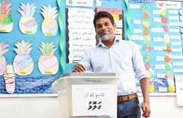 Amru casts his ballot in the party's internal election held by The Democrats yesterday -- Photo: Nishan Ali