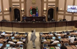 Kaashidhoo MP Abdulla Jabir protests inside the parliament chamber during Monday's sitting--