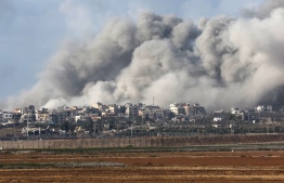A picture taken from southern Israel near the border with the Gaza Strip on December 9, 2023, shows smoke rising during an Israeli strike in Gaza amid ongoing battles with the Palestinian Hamas militant group. -- Photo: Jack Guez / AFP