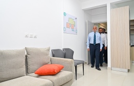 Housing Minister Dr Haidar visits a sample flat at the FDC built flat complex.