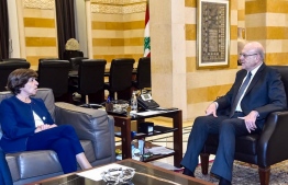 This handout picture provided by the Lebanese Prime Minister's press office shows Lebanon's caretaker Prime Minister Najib Mikati (R) receiving French Foreign Minister Catherine Colonna at the government palace in Beirut on December 18, 2023. -- Photo by Lebanese Prime Minister's Press Office / AFP