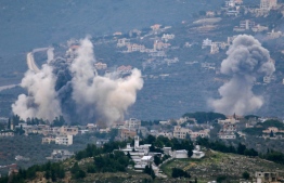 Smoke billows after Israeli bombardment over Lebanon's southern town of Kfar Kila near the border with Israel on December 21, 2023, amid ongoing cross-border tensions as fighting continues between Israel and Hamas militants in Gaza. -- Photo: AFP