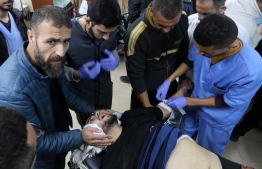 A man injured in an Israeli bombardment receives medical care at the emergency ward of the al-Aqsa hospital in Deir al-Balah in the central Gaza Strip on December 30, 2023, as battles between Israel and the Palestinian Hamas movement continue. -- Photo by AFP