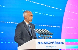 President Dr. Mohamed Muizzu speaks at the 'Invest Maldives' business forum organized by Maldives in China -- Photo: President's Office