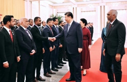 President of China Xi Jinping greets Maldives' Tourism Minister Faisal.