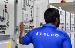 [FILE] A STELCO employee at work: the public is encouraged to exercise caution amid rising electricity consumption