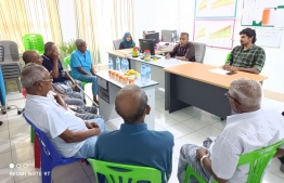A group of concerned Kaashidhoo residents meet at the island's Health Centre to discuss the case of the hereditary disease.-- Photo: Kaashidhoo Health Centre