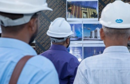 Minister of Islamic Affairs Dr. Mohamed Shaheem Ali Saeed (M) looking at illustrations of the new permanent mosque developed in Hulhumale 2 on Thursday, January 18, 2024 -- Photo: Ministry of Islamic Affairs