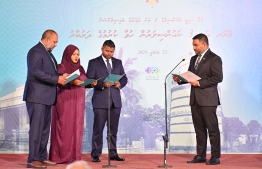 Three members elected for the Malé City Council take their oath of office. -- Photo: Nishan Ali