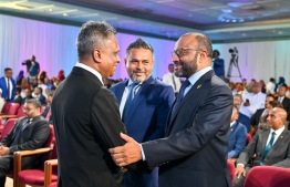Minister of Islamic Affairs, Dr. Shaheem Ali Saeed congratulates opposition MDP candidate Adam Azim for his election as Mayor of Malé City. -- Photo: Nishan Ali