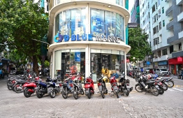 Motorcycles parked around DBlue Marine shop near Malé Clock Tower. -- Photo: Fayaaz Moosa
