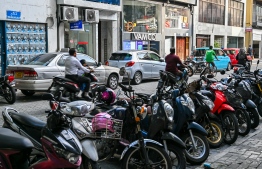 Motorcycles and cars parked on both sides of Orchid Magu. This route faces heavy traffic during school hours when students are going to and coming home from school. -- Photo: Fayaaz Moosa