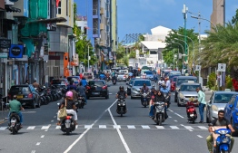 Motorcycles and cars parked on either side of Boduthakurufaanu Magu: The government has decided to construct parking buildings to address the problem of traffic congestion in the Malé area. -- Photo: Fayaaz Moosa