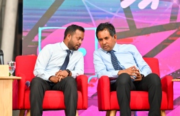 Minister of Construction and Infrastructure Abdulla Muttalib and Minister of Economic Development and Trade Mohamed Saeed speaking by themselves at the Ahaa Forum on January 25, 2024 -- Photo: Nishan Ali