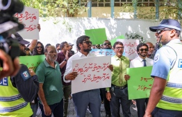 Protesters gather outside parliament: protesters call for MP Easa' arrest