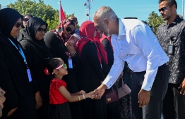 President greets the public on his arrival at Thaa Atoll Guraidhoo.--Photo: President's Office