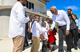 President Muizzu greets the children of Thaa atoll Dhiyamigili during his Thaa atoll tour. -- Photo: President's Office