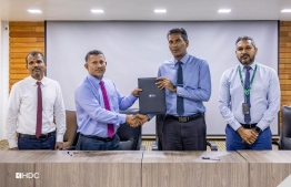 Representatives of HDC and the Centre for the Holy Quran showing agreement made between the two parties, where a commercial unit from Hiyaa Flats was allotted to the Centre to open an office in Hulhumale', on Thursday, February 15, 2024 -- Photo: HDC
