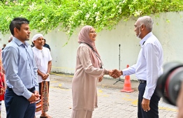 President Dr Muizzu and Minister Shiham shakes hands as Vice President Latheef stands by.-- Photo: Fayaz Moosa / Mihaaru