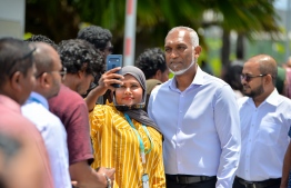 A resident of Addu City takes a selfie with President Dr. Muizzu