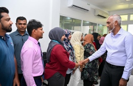 Members of the Addu City Council and the Women's Development Committee greet President Dr. Mohamed Muizzu during his first visit to Addu after assuming office -- Photo: President's Office