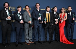 (L-R) Benny Safdie, Cillian Murphy, Robert Downey Jr., Josh Hartnett, Alden Ehrenreich, Casey Affleck, Emily Blunt and Kenneth Branagh, winner of the Outstanding Performance by a Cast in a Motion Picture award for 'Oppenheimer' pose in the press room during the 30th Annual Screen Actors Guild Awards at the Shrine Auditorium in Los Angeles, February 24, 2024. -- Photo: Robyn Beck /AFP