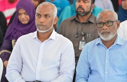 President Dr Mohamed Muizzu and Special Advisor to the President, Abdul Raheem Abdulla in attendance at the ceremony held to facilitate the president's address of the residential community of Sh. Kanditheemu during his visit