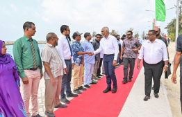 The residential community of N. Holhudhoo welcoming the President Dr Mohamed Muizzu upon his arrival -- Photo: President's Office