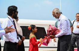 The President being welcomed in Raa atoll Alifushi.