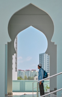 A person leaves the mosque after attending prayers -- Photo: Fayaz Moosa