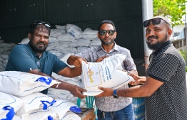 Government-issued staples, consisting of 10 kilograms of flour and 10 kilograms of rice for each household being distributed from the Public Service Affairs building of the City Council -- Photo: Fayaz Moosa