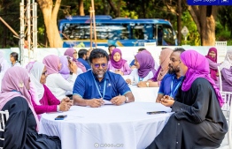 CEO of MTCC speaking with some female employees in attendance at the ceremony held by the company to celebrate Women's Day -- Photo: MTCC