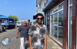 Athoof standing near the Male' City Marketplace on the first day of Ramadan