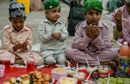 Muslim children offer prayers before breaking their fast on the first day of the Islamic holy month of Ramadan at the Mecca Masjid in Hyderabad on March 12, 2024. -- Photo: Noah Saleem / AFP