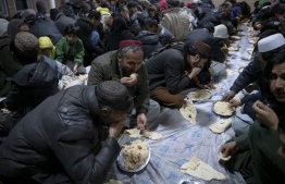 Afghan Muslims break their fast during the Islamic holy month of Ramadan at the Wazir Akbar Khan mosque in Kabul on March 12, 2024. -- Photo: Wakil Kohsar / AFP