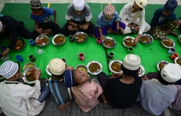 Muslim devotees prepare Iftar dinner at the Nwe Aye Mosque on the first day of the holy Islamic month of Ramadan in Yangon on March 12, 2024. -- Photo by Sai Aung main / AFP