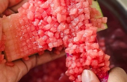 Watermelon being diced finely for the perfect glass of Karaa Fani.-- Photo: Najeela Adam