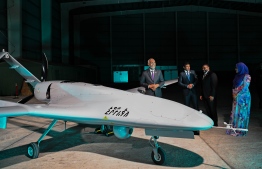 President Muizzu, First Lady Sajidha, Vice President Hussain and Minister of Defence Ghassan stand next to a drone after the launching ceremony of Maldives first military drones held last night -- Photo: President's Office