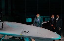 President Dr Mohamed Muizzu observing a military drone acquired from Turkey Minister the historical event last night held to initiate the military drone service while Minister of Defence, Mohamed Ghassan Maumoon and Vice President Hussain Mohamed Latheef stands next to him -- Photo: President's Office