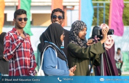 Students of Dhaalu Atoll Education Centre engaged in getting coverage of sporting events.-- Photo: Dhaalu Atoll Education Centre