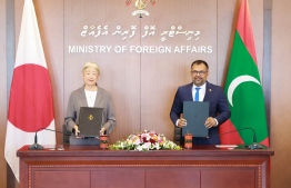 Ambassador of Japan to Maldives Takeuchi Midori and Foreign Minister Moosa Zameer sign the agreements of grant aid.-- Photo: Foreign Ministry