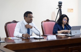 MMA's Deputy Governor Imad and Assistant Governor Idham at yesterday's meeting of the Parliament's Public Accounts Committee.-- Photo: Majlis Secretariat