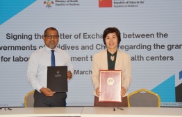 Signing of the Letter of Exchange between Minister of Health, Abdulla Haleel (L) & Chinese Ambassador to Maldives, Wang Lixing. -- Photo: Health Ministry