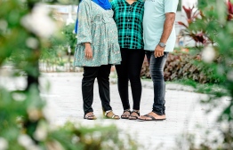 The eldest daughter with her parents during the mother's pregnancy photoshoot. -- Photo: Asad's Photography