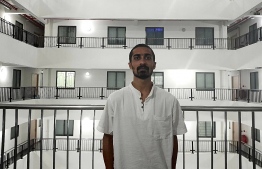 Jailam posing for the Edition outside his apartment flat.