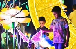 Children admire the 'Eid Ali' decorative fixtures.-- Photo: Fayaz Moosa / Mihaaru